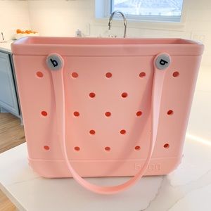Brand new never used Baby Bogg Bag - light peachy pink.